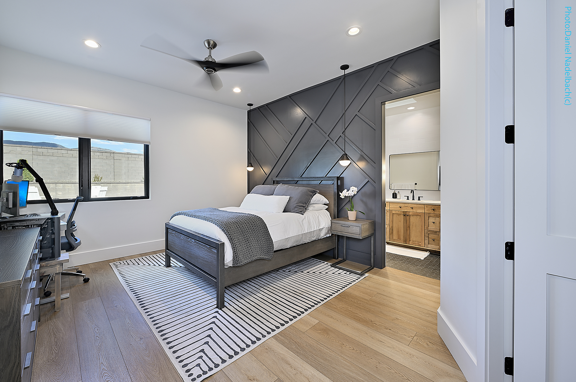 Guest bedroom with geometric accent wall